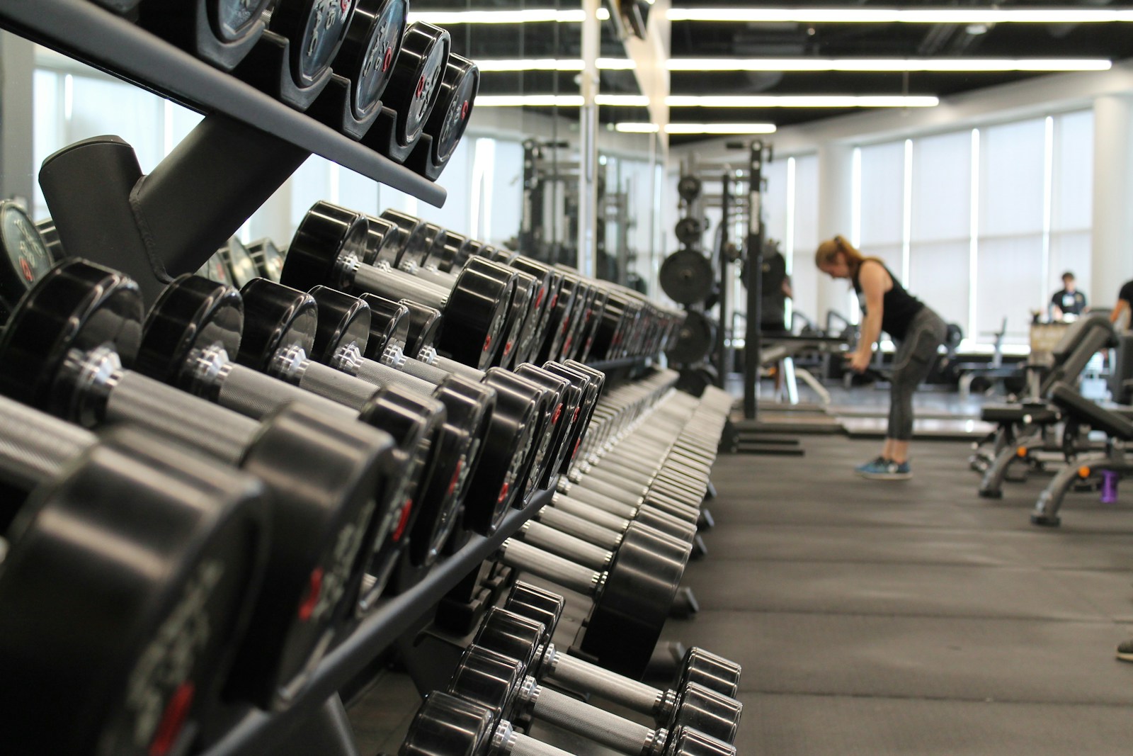 Modern gym with dumbbells and equipment